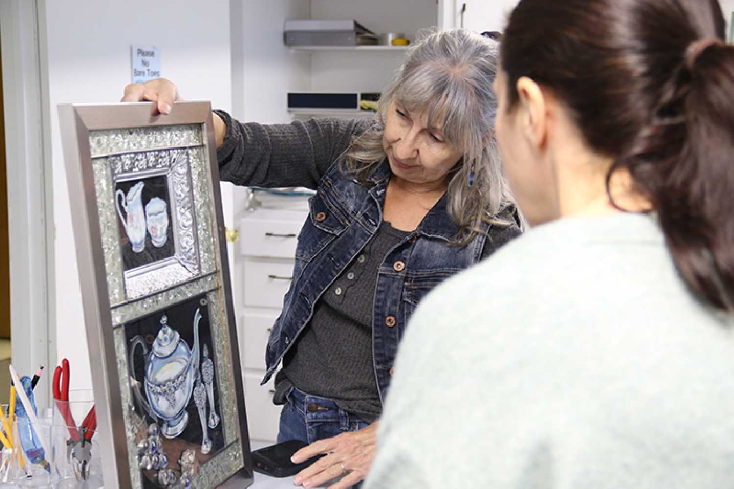 Artist Darlene Strong displays a stained glass work she made in honor of her mother, featuring her mothers silverware. She has donated $5,000 worth of stained glass supplies and equipment to the Moosomin Visual Arts Centre, where she will teach stained glass classes.